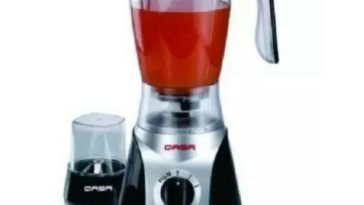 Woman blending smoothie using Qasa blender in Nigerian kitchen